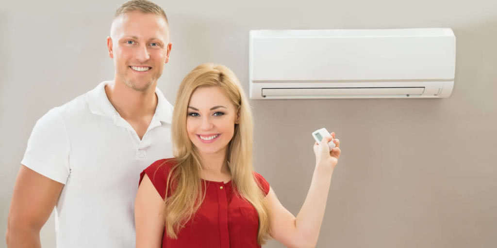couple with Ductless Ac unit
